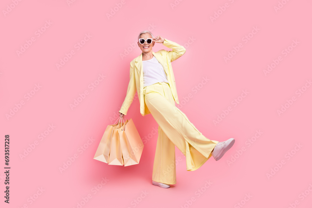 Sticker full body size photo of fashionable lady white hair touching sunglasses bring yellow bargain package