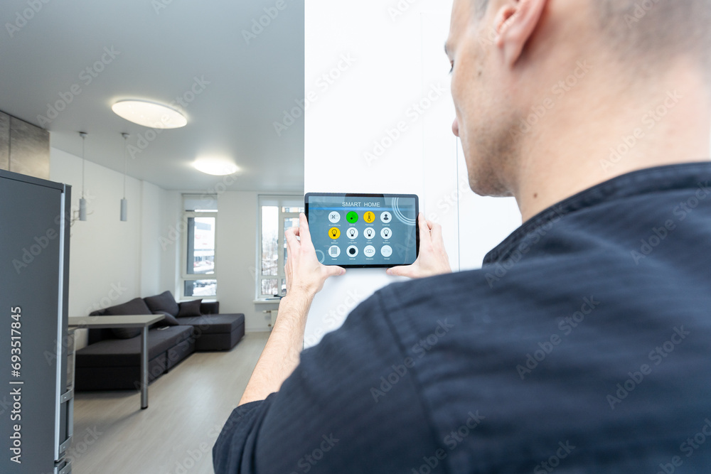 Aufkleber man using smart home security system control panel