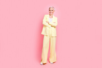Full body photo of businesswoman yellow suit crossed arms posing at new york times international...
