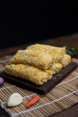 risoles filled with chicken, indonesian food, coating with bread crumb, decorated with condiment and garnish, unfried food.