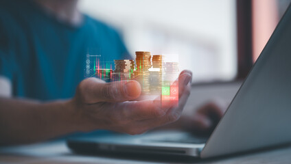 investment and finance concept, businessman holding virtual trading graph and blurred coins on hand, stock market, profits and business growth. - obrazy, fototapety, plakaty
