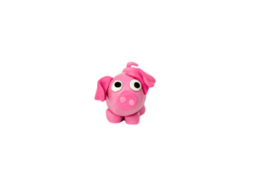 pig figurine made of plasticine on white background