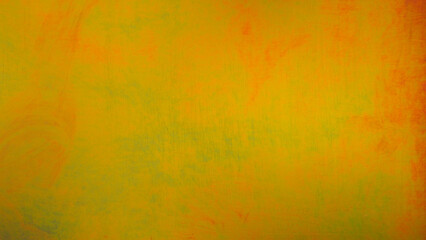 An image of a shiny metal wall painted in a golden yellow and green. Image for use in Background or...