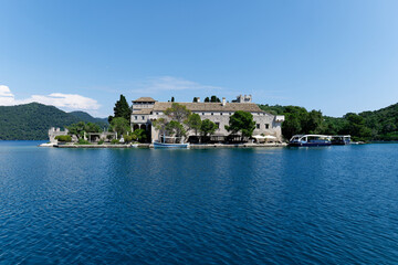 Fototapeta na wymiar Islet Holy Mary in the Mljet National Park, Croatia. The Church and Benedictine Monastery on St. Mary’s island on Mljet are among the oldest church complexes in the Adriatic.