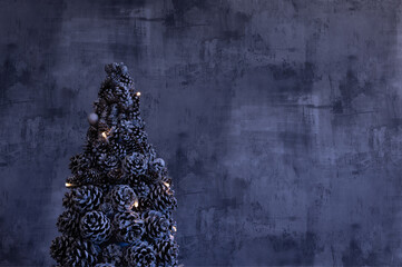 Modern Christmas tree made of pine cones