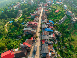 Aerial view of Bandipur from Thani mai temple hill. Nepal. Main street with shops and commercial...
