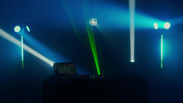 DJ Setup with Vibrant Light Show in Club Atmosphere