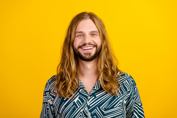 Photo of good mood cheerful man dressed print shirt smiling isolated yellow color background