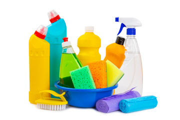 Cleaning items in a bucket isolated on a white background. Cleaning products for home cleaning isolated.Cleaning concept.Close-up. Household chemicals.detergents in plastic bottles, sponges and gloves