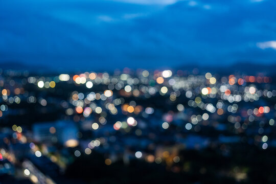 City abstract bokeh background at twilight, blurred aerial view of cityscape