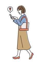 スマホのナビを見ながら歩く女性