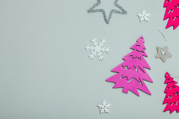 Traditional New Year composition in pink color tones. Festive decor, handmade Christmas trees
