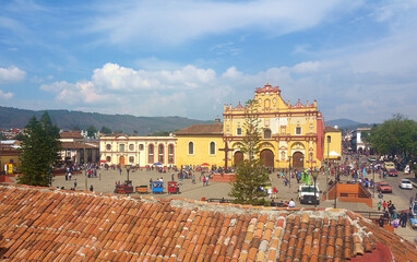 visitors walk in front of the baroque cathedral in La Plaza De La Paz in San Cristobal de las Casas, Chiapas,  © Yuriy T