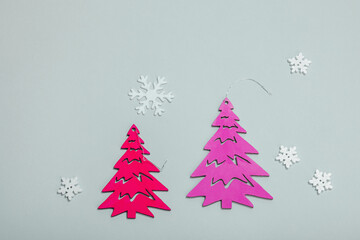 Traditional New Year composition in pink color tones. Festive decor, handmade Christmas trees