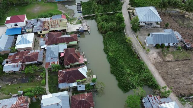 Aerial view of the house by the river
