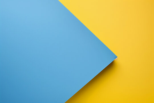 Blue and yellow paper background with copy space for text or image.