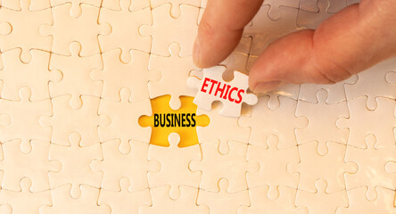 Business ethics symbol. Concept words Business ethics on beautiful white paper puzzle. Beautiful...