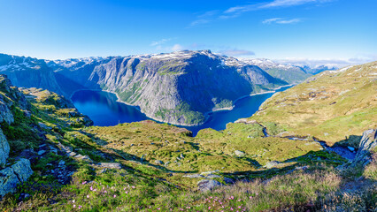A view of the fjord on a summer day in the Hardanger fjord National park, Norway - obrazy, fototapety, plakaty
