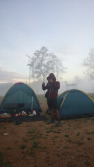 A climber surrounded by fog on Arang Hill in the morning