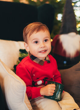 a little boy playing during the Christmas holidays
