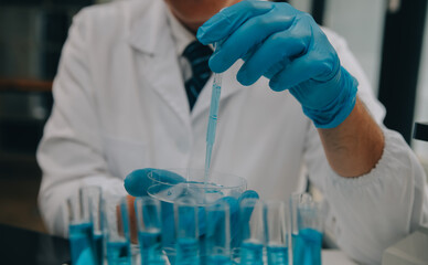 Scientist or medical in lab coat working in biotechnological laboratory, Microscope equipment for...