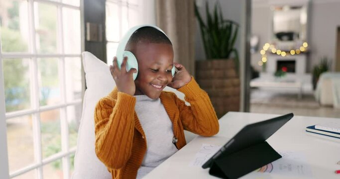 Headphones, tablet and children dancing to music, playlist or album online on the internet. Happy, digital technology and young African kids listening to a song or radio and moving at their home.