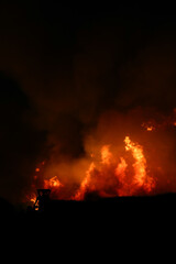 Fototapeta na wymiar Fire from a sugar cane farm at night