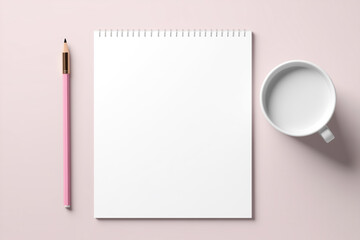 Notebook on soft pink background, spiral notepad on table