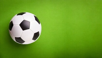 Soccer ball Isolated, green background, text space