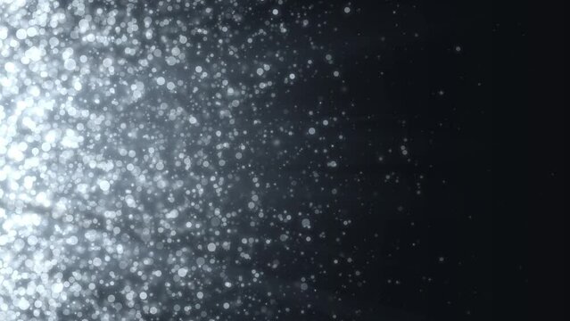 On a dark silver background, white spheres fly from left to right. Animation of abstract background with free space. For vertical and horizontal use.