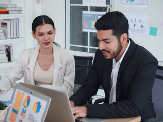 Portrait business team woman and man Asian group meeting sitting on desk looking talk idea hand holding laptop notebook on table ready for happy working new project job online sale inside home office