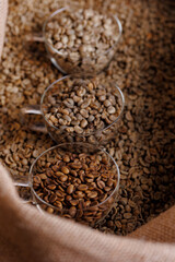 Various stages roasting of coffee beans showing from green through to brown italian roast, top view