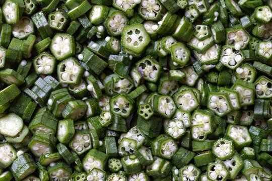 Okra or Lady's Finger Slices Heap Background, Also Known as Abelmoschus Esculentus