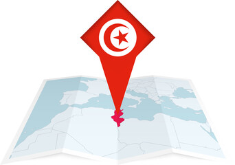 Tunisia pin flag and map on a folded map