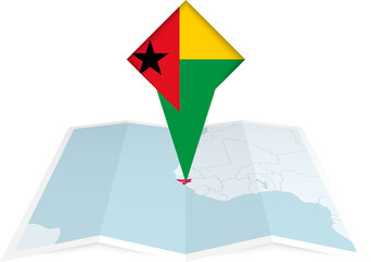 Guinea-Bissau pin flag and map on a folded map