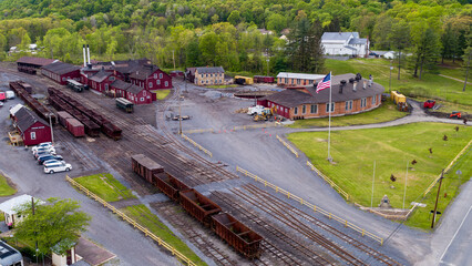 An Aerial View of a Narrow Gauge Train Yard, With Coal Hoppers, Shops and Roundhouse, on a Sunny...