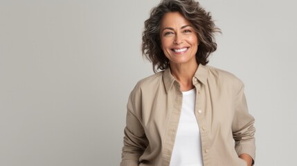Obraz premium Confident smiling Latin professional mid aged elegant business woman corporate leader, happy beautiful mature female executive, lady manager standing isolated looking at camera, headshot portrait