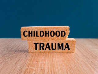 Childhood trauma symbol. Concept words Childhood trauma on brick blocks. Beautiful dark blue background. Business psychology childhood trauma concept. Copy space. - obrazy, fototapety, plakaty