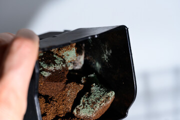 Mold coffee grounds. Background with granulated instant coffee grounds spoiled by mold. unhealthy...