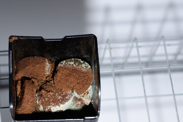 Mold coffee grounds. Background with granulated instant coffee grounds spoiled by mold. unhealthy...