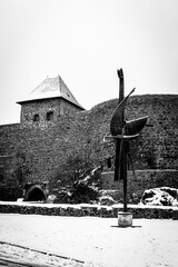 Front view of the medieval castle Helfštýn with steel scupture