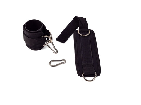 Leg loops with D-rings, leg cuffs and carabiners on a white background. Leg straps or cuffs for fitness training.