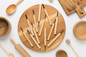 Carpenter tools with wooden objects on color background ,top view
