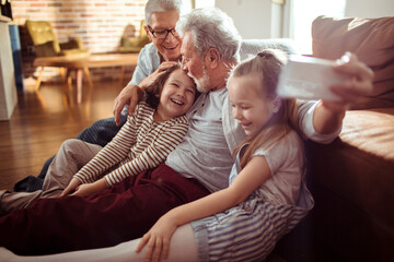 Grandparents having fun with Grandkids in the living room