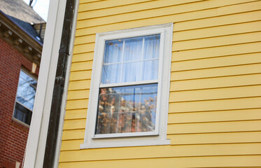 Suburban house, symbolizing increasing mortgage rates and inflation impact on real estate market