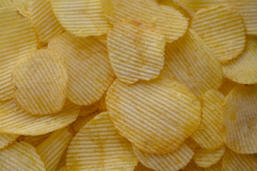 food background from delicious chips poured out of a pack 5 - obrazy, fototapety, plakaty