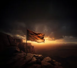 Fotobehang Tattered flag waving in the wind on a mountain overlooking a desert © Jason