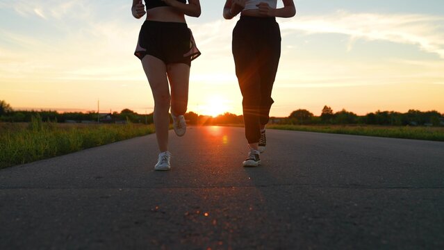 two friends running sunset, team group girls running sunset, silhouette athletic girls, teamwork legs athlete running road, training running health, club like-minded people, outdoor exercise, you can
