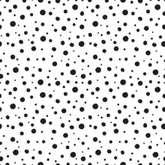 Organic black dots ranging in size on a white background seamless pattern. Stock vector for printing on different surfaces. 