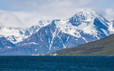 Lyngenfjord in Troms eg Finnmark in Norway with massice mountains with ice and snow